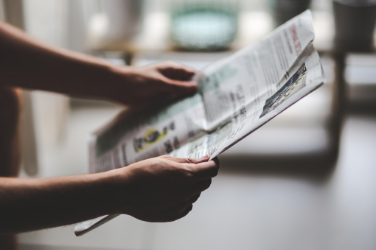 Man Reading Paper